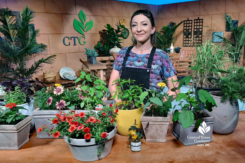 smiling woman on CTG set with small containers of colorful plants 