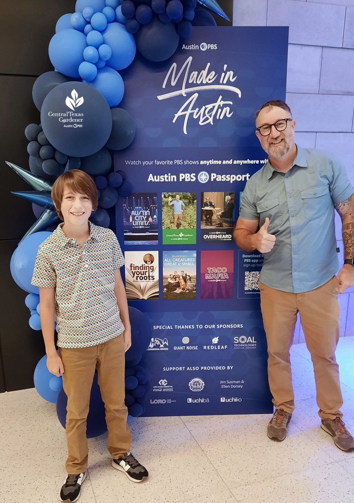 man and son in front of Made in Austin Austin PBS sign 