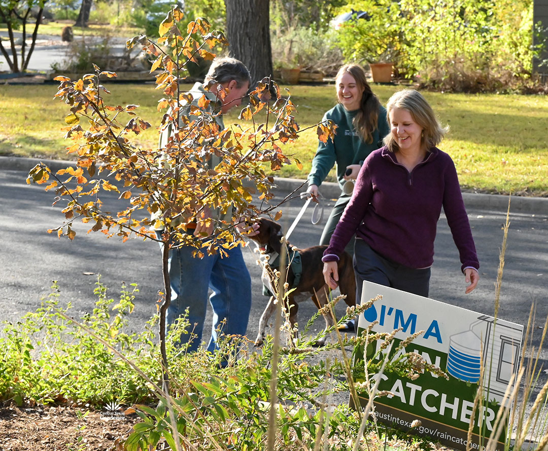 neighbor with dog greeting Larry and Jessica