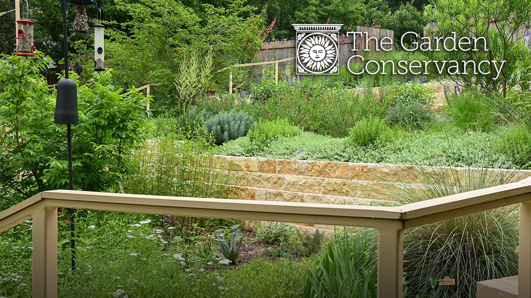 layers of plants in limestone tiers with The Garden Conservancy logo at the top