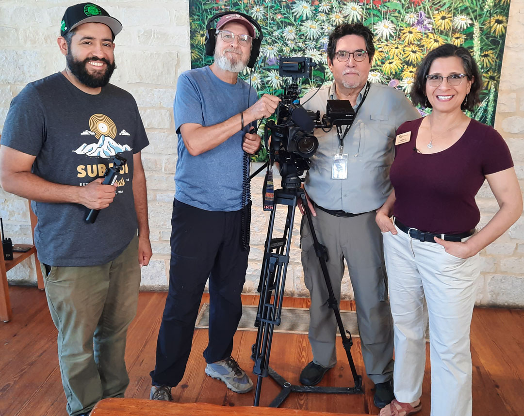 three men with recording gear (camera, microphone) with Andrea 
